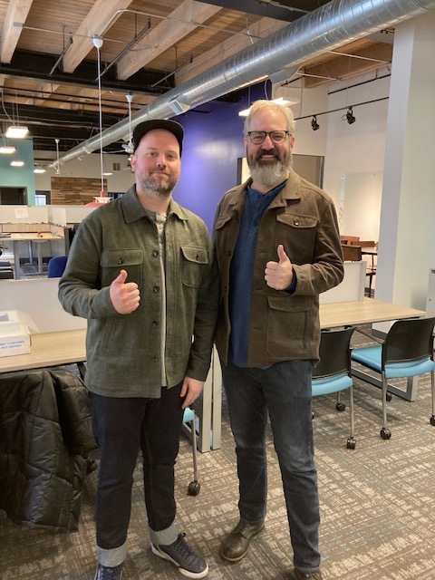 Two team members twinning at the Chicago Office