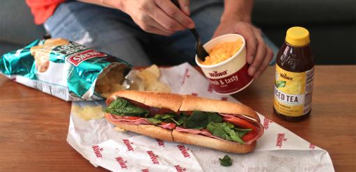 Wawa lunch consisting of mac n cheese, hoagie, chips, and a drink
