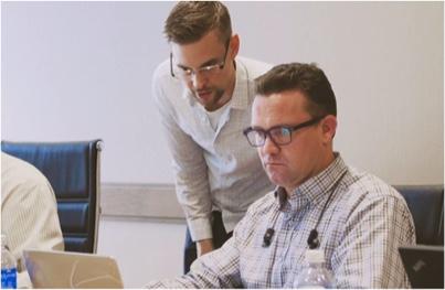 attendee and trainer working together